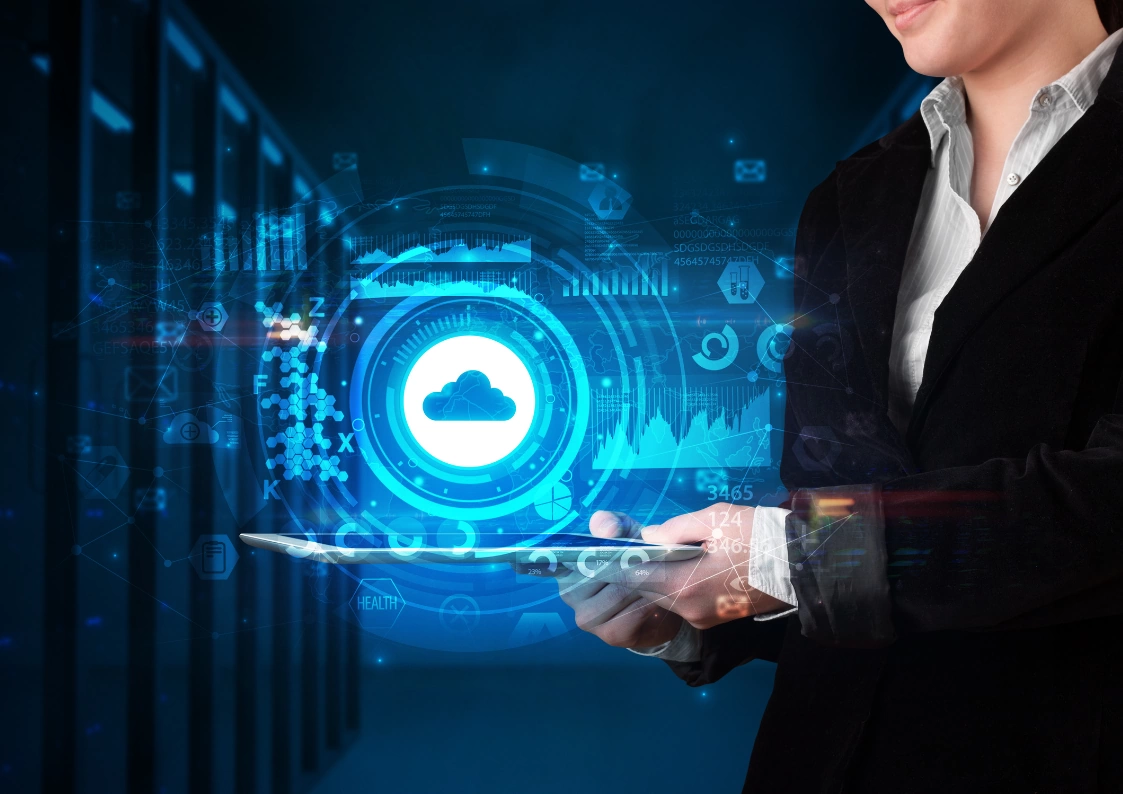 BizTalk Server and cloud integration: A woman in business attire interacts with a tablet displaying a cloud icon and data visualizations, symbolizing the connection between BizTalk and cloud services.