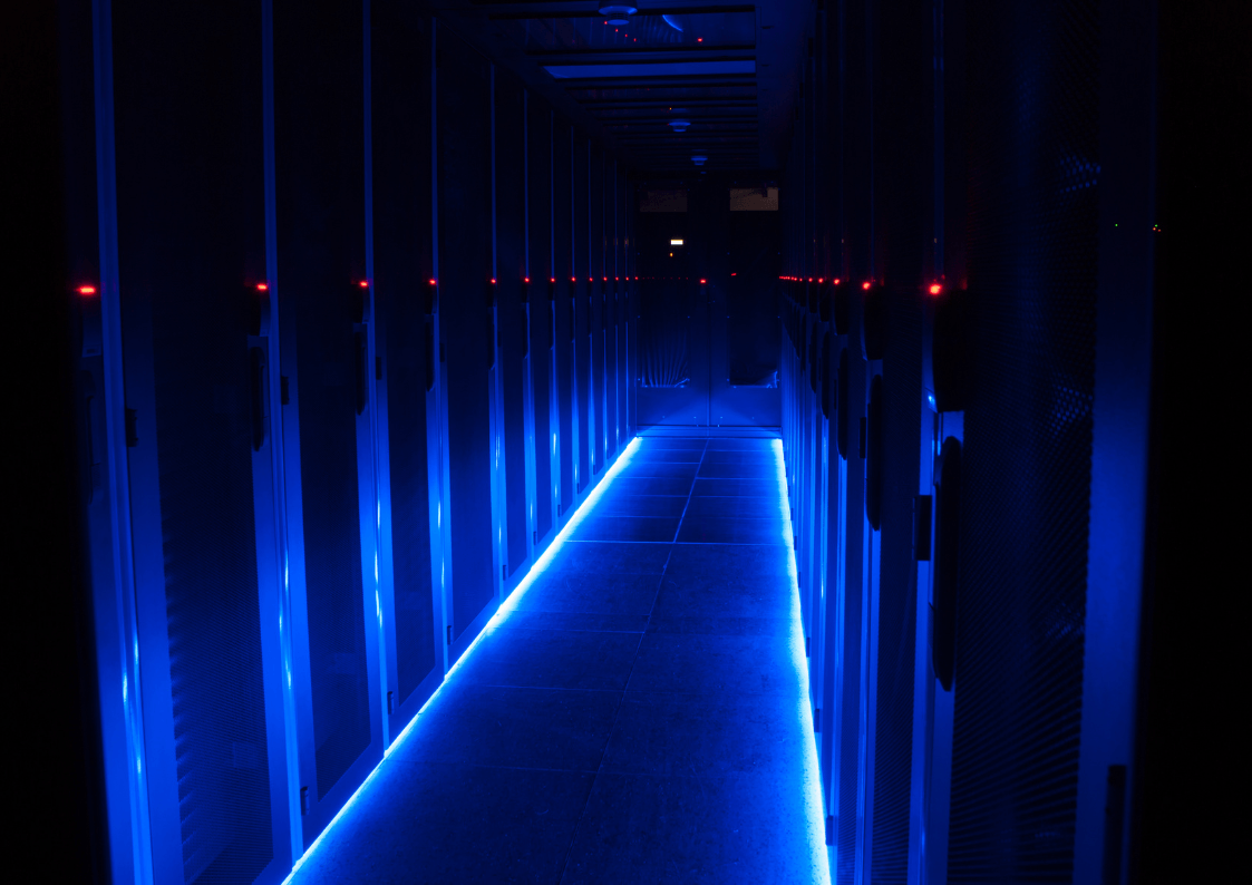 Data center aisle with server racks hosting insurance core systems and integration infrastructure